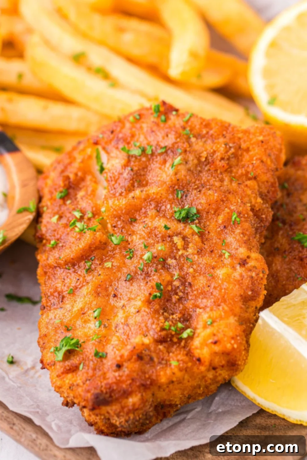 A simple yet appetizing plate of Air Fryer Fish, showcasing the light golden brown crust and promising a delicious meal.