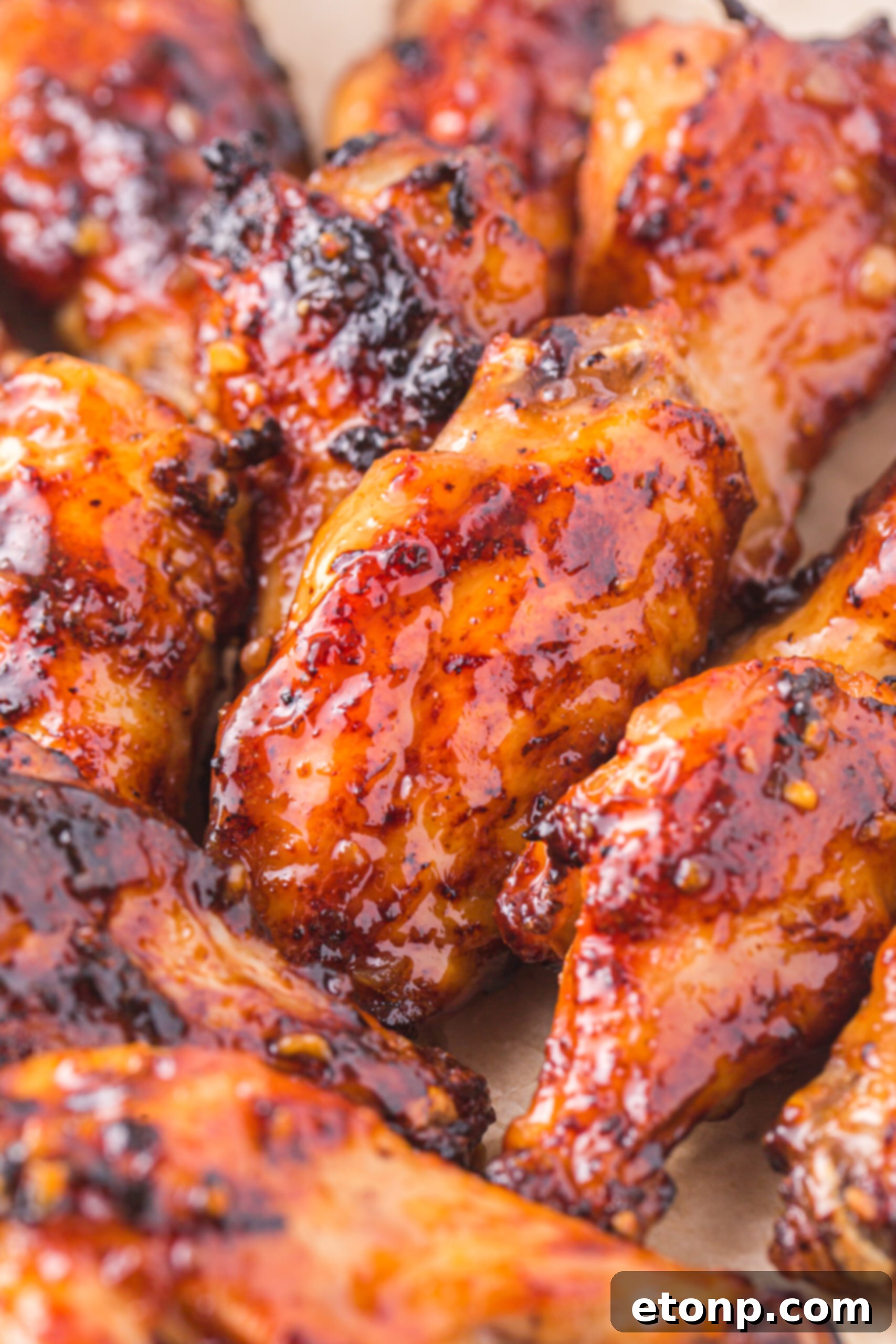 The Best Crispy Honey Garlic Air Fryer Chicken Wings 23 An up-close shot of beautifully glazed Air Fryer Honey Garlic Chicken Wings, showcasing their sticky texture and golden-brown perfection.