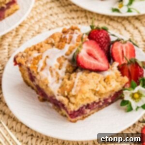 Fresh Strawberry Coffee Cake 24 slice of Strawberry Coffee Cake on plate garnished with strawberries and flowers