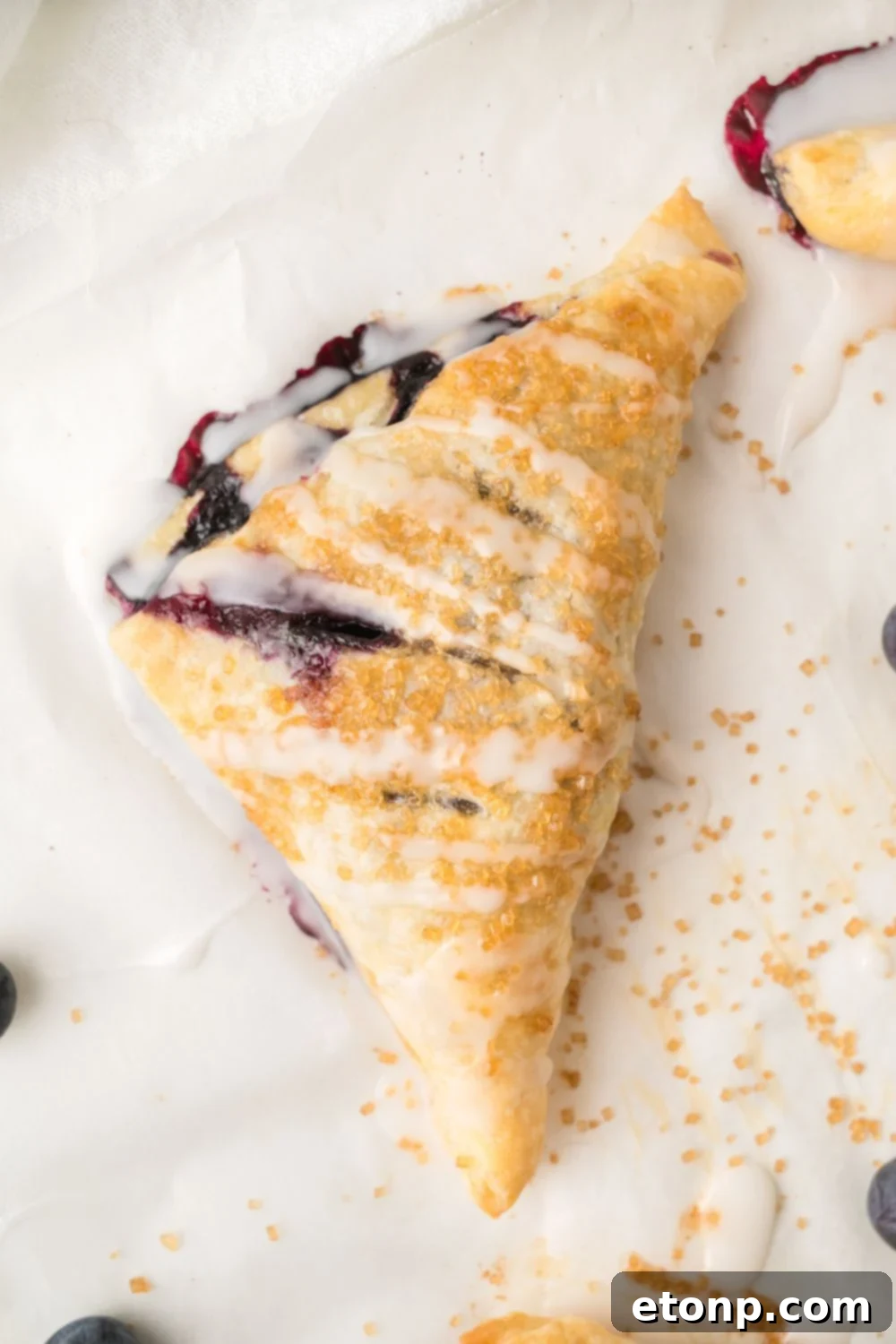 overhead of Blueberry Turnover on parchment paper 