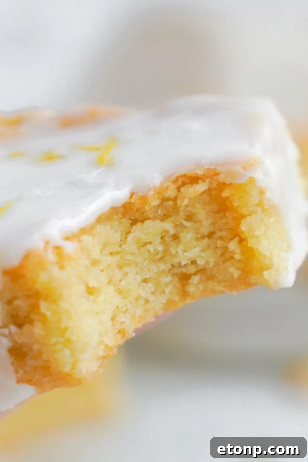 Lemon Sugar Cookie Bar with a bite taken out of it 