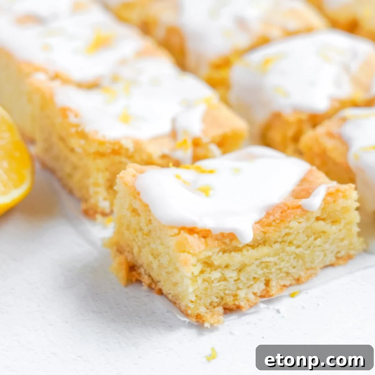 Lemon Sugar Cookie Bars cut and sat on table 