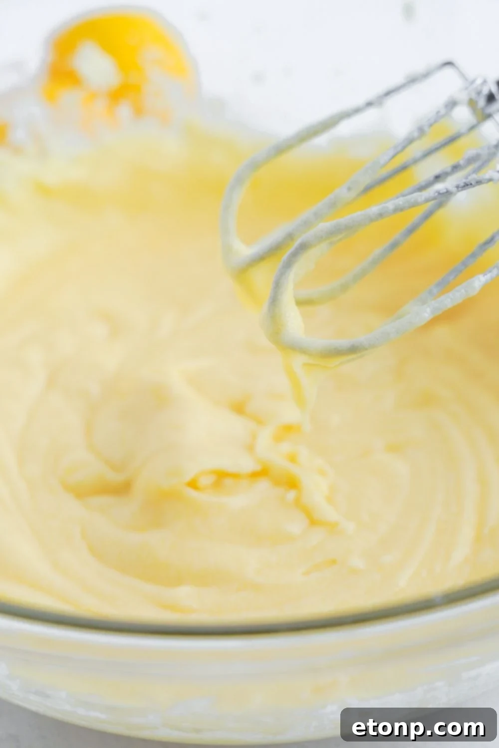 whipped batter for Lemon Sugar Cookie Bars in a glass bowl