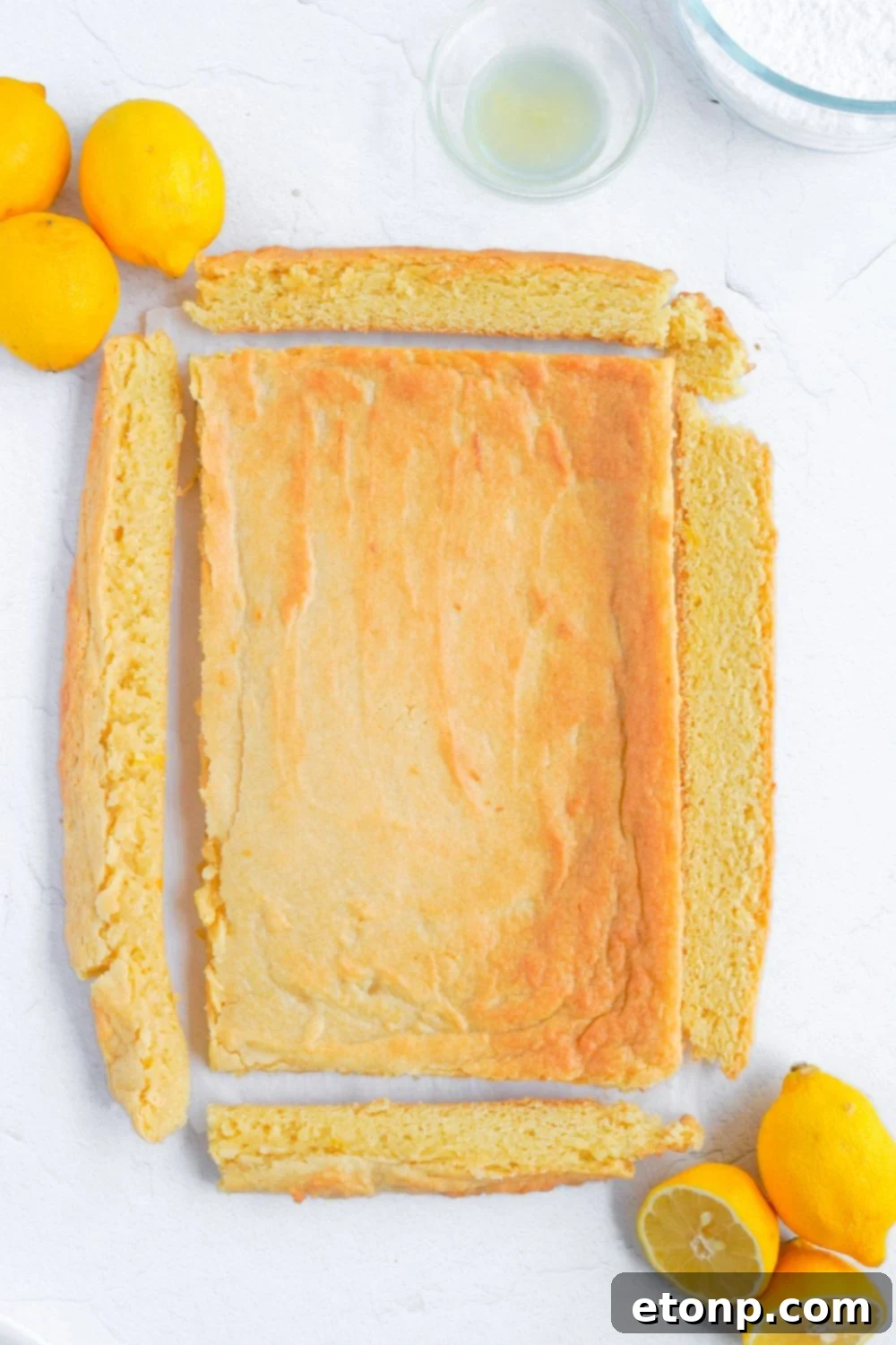edges of lemon bars cut off to make a rectangle 