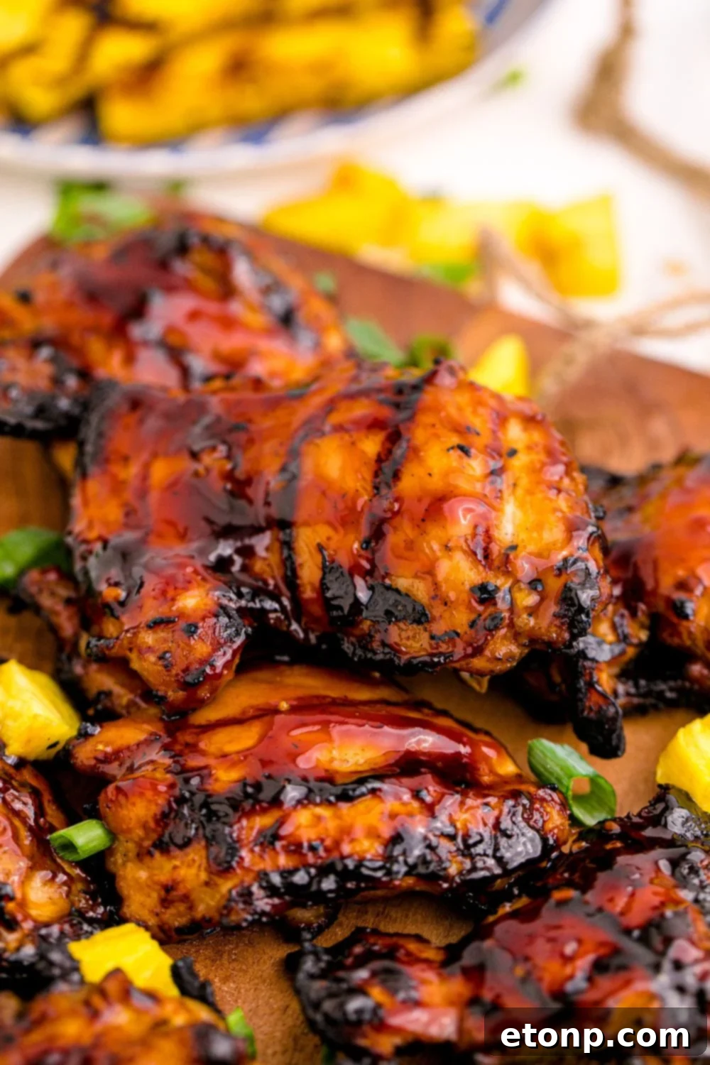 Beautifully glazed Huli Huli Chicken pieces served on a platter, showcasing their appealing sticky coating