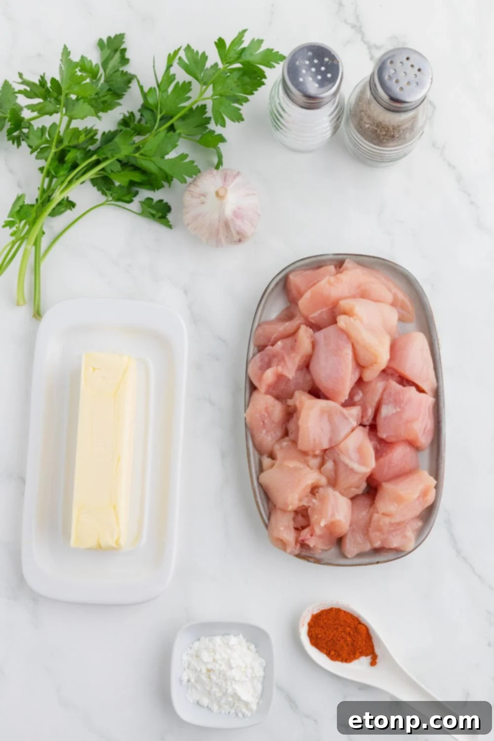 Buttery Garlic Chicken Bites 5 ingredients for Garlic Butter Chicken Bites on table in single serve containers