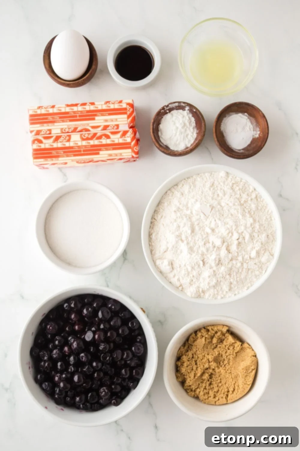 ingredients for Blueberry Crumb Bars in single serve containers on table 