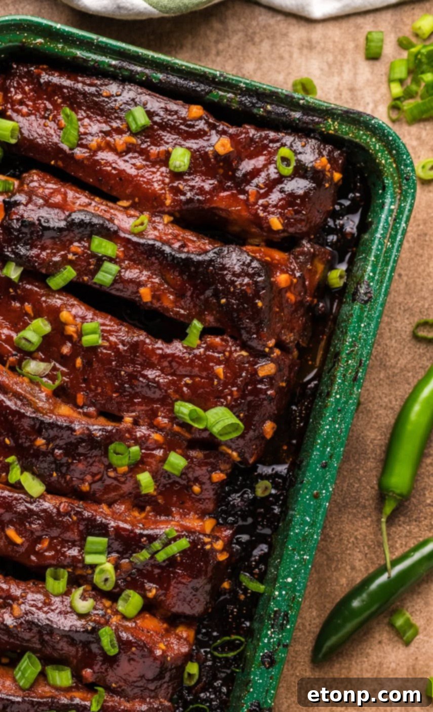 Close-up of ribs being glazed