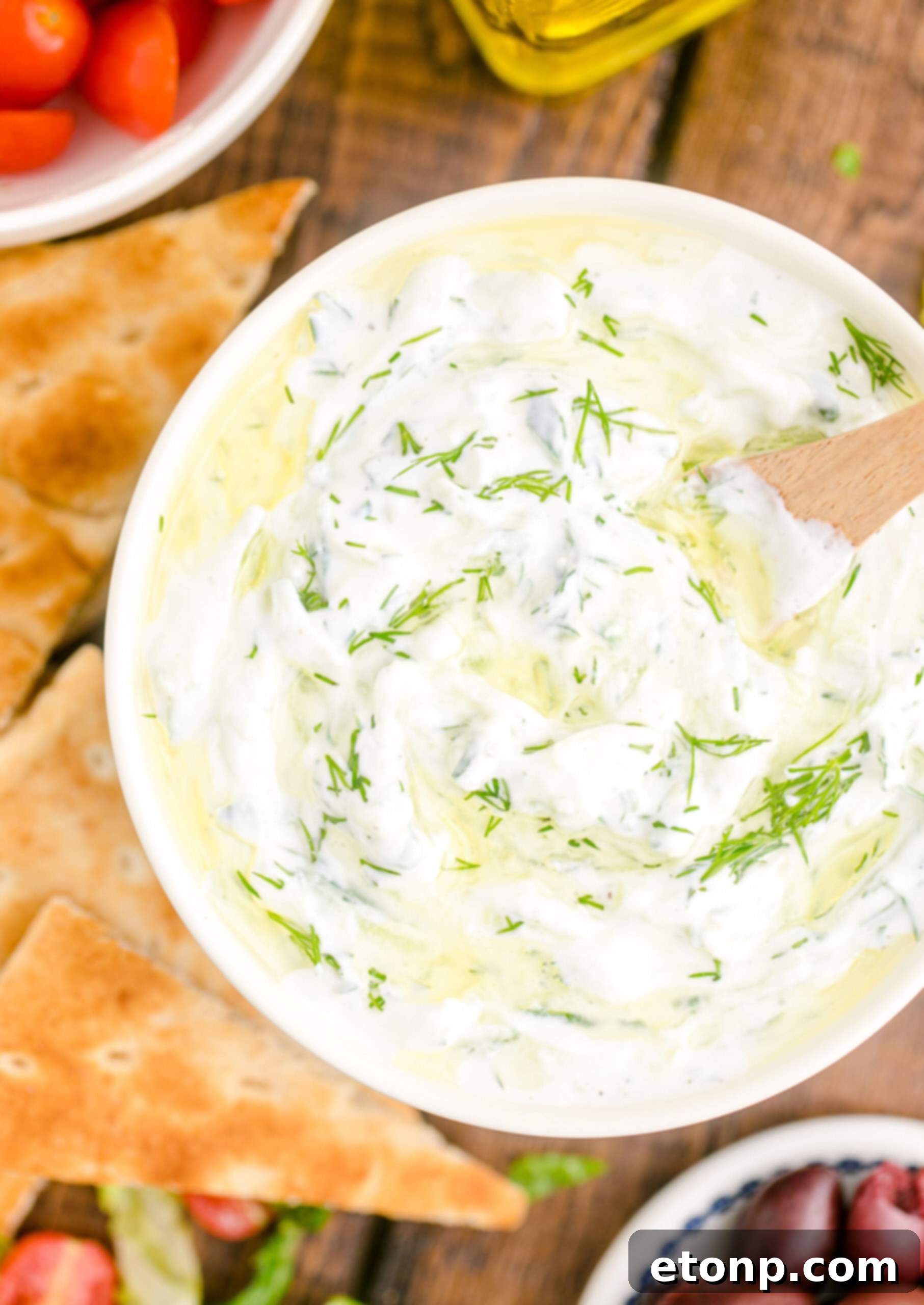 overhead shot of the Tzatziki Sauce in a white and blue bowl 