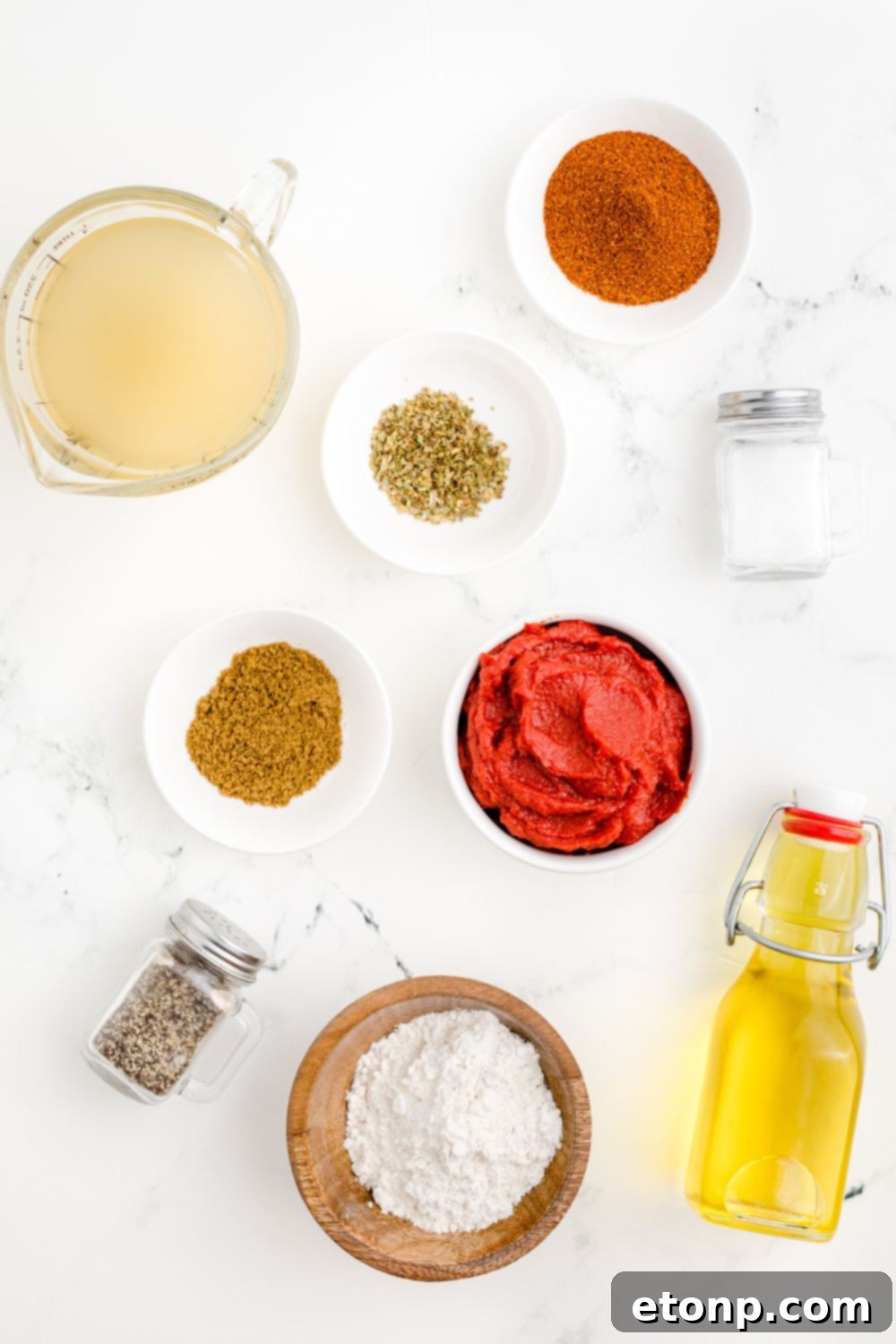 From Scratch Enchilada Perfection 5 ingredients for Homemade Enchilada Sauce in single serve bowls on table, perfectly measured and organized