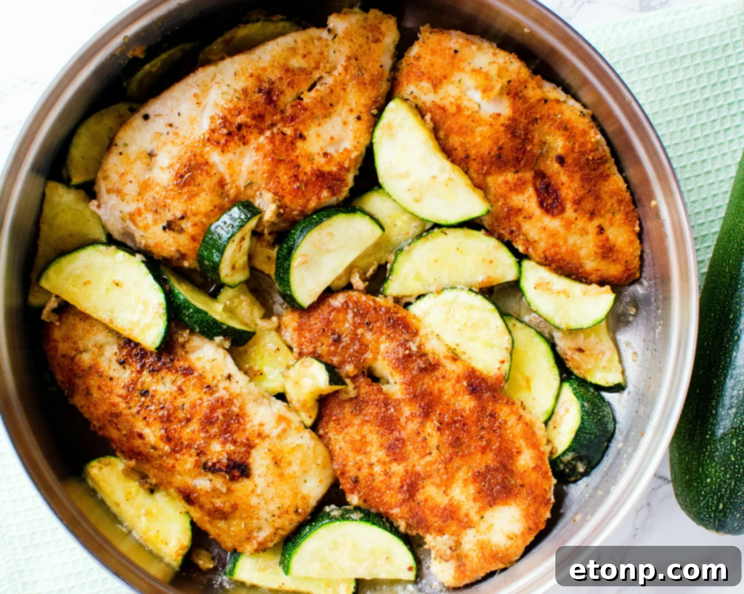 Crispy Parmesan Chicken and Garlicky Zucchini Skillet 8 The finished Pan-Fried Parmesan Chicken and Zucchini dish in a serving bowl