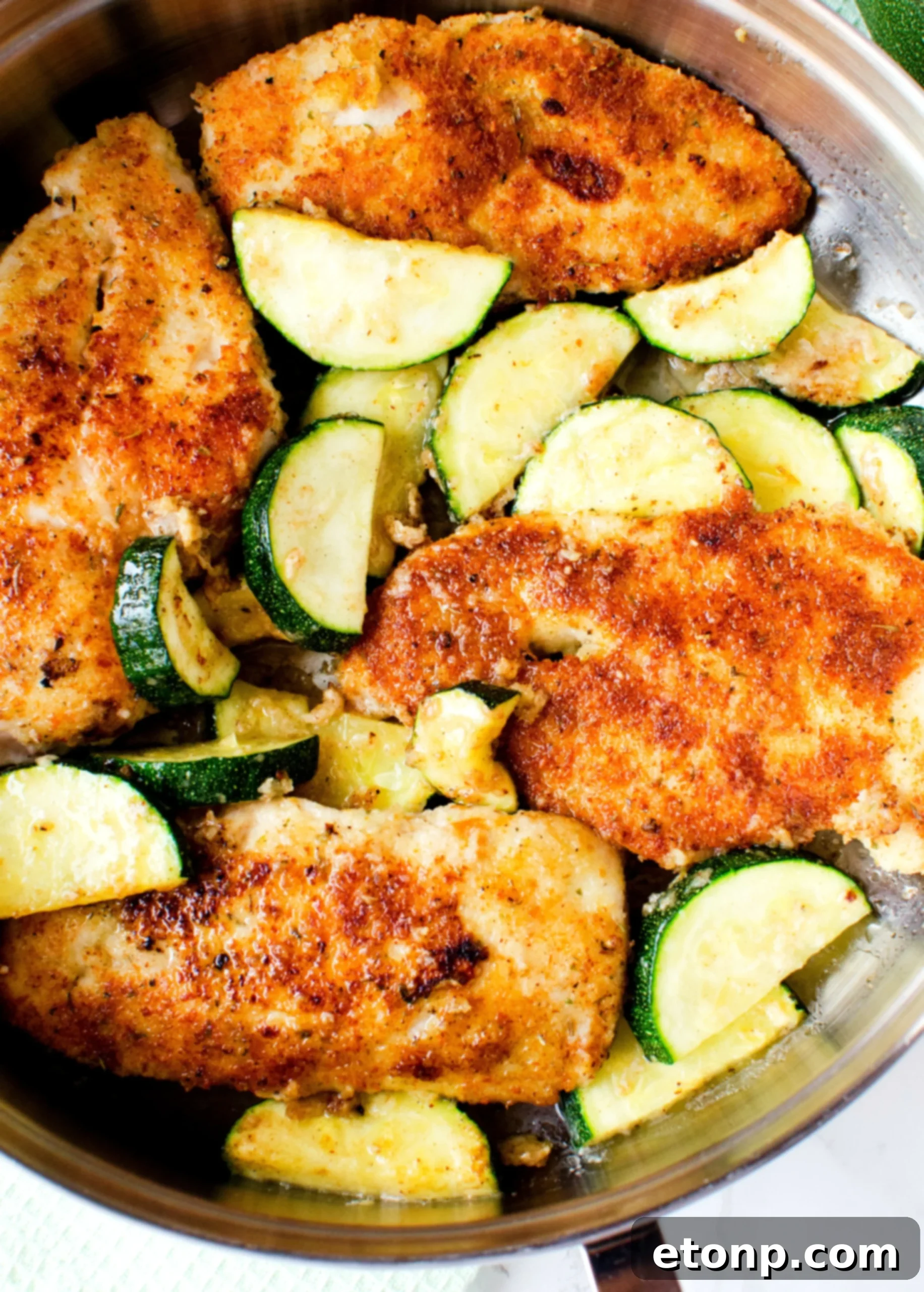 Crispy Parmesan Chicken and Garlicky Zucchini Skillet 9 Healthy and nutritious serving of pan-fried chicken and zucchini