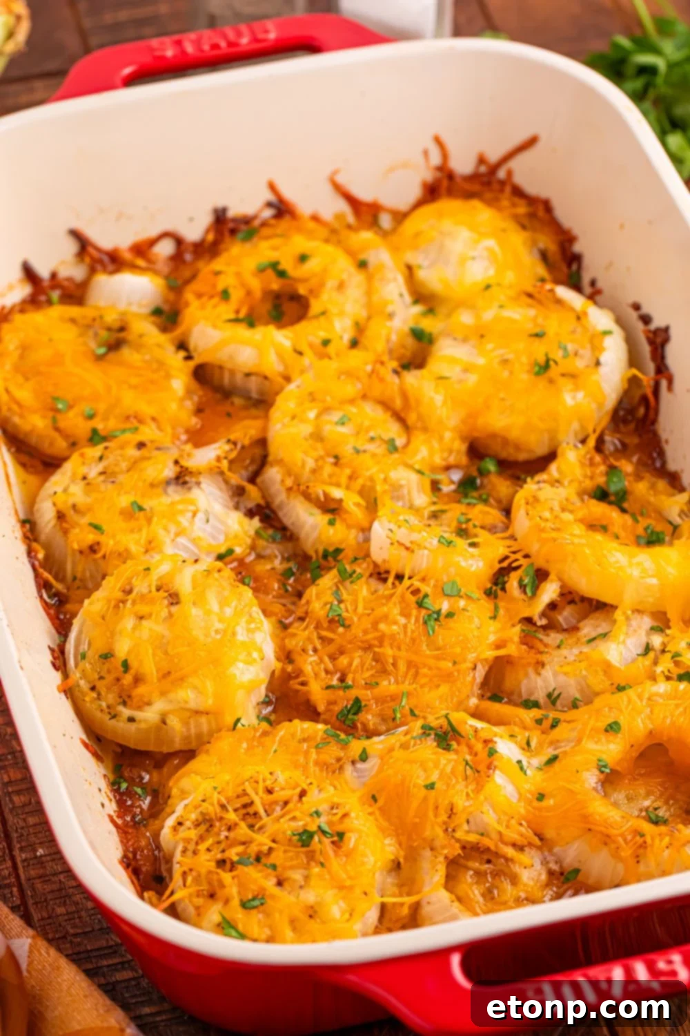 Cheesy Tennessee Onion Bake 13 A large casserole dish of oven-baked cheesy onions, featuring a rich golden crust.