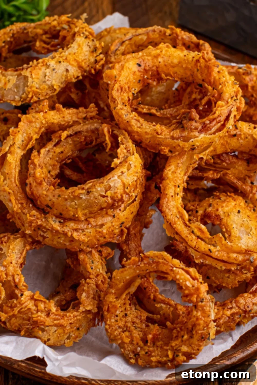 Golden Crispy Homemade Onion Rings 20 Homemade Deep Fried Onion Rings in a bowl on table