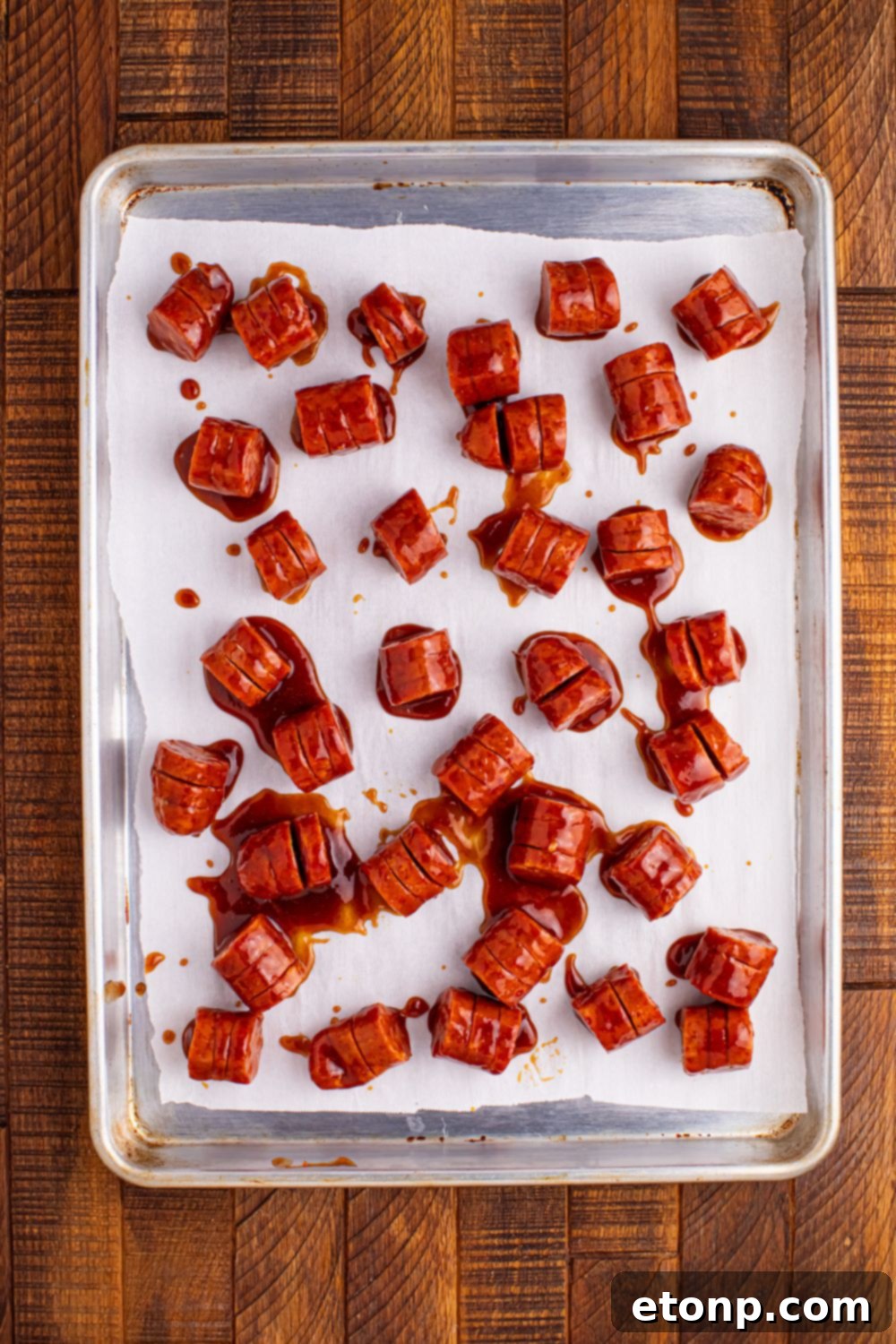 BBQ Hasselback Smoked Sausages on baking tray 
