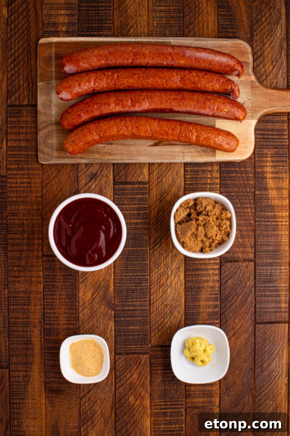 ingredients for BBQ Hasselback Smoked Sausages on wooden table