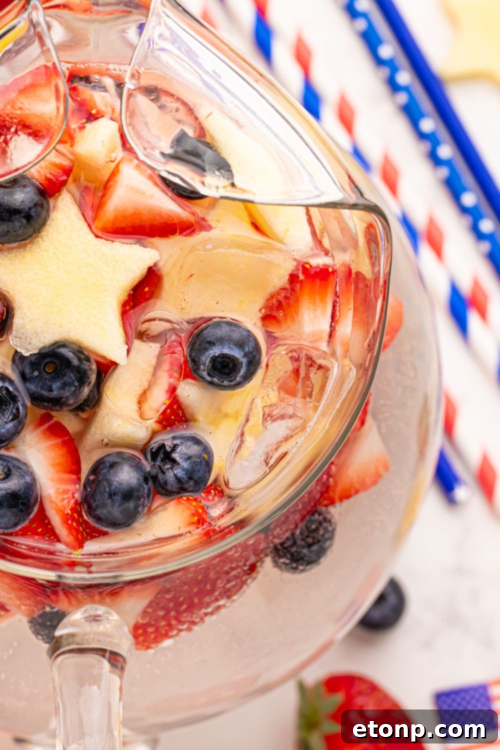 Liberty Lemon Sparkle 5 overhead look of pitcher with Patriotic Sparkling Lemonade with red white and blue straws to side on table