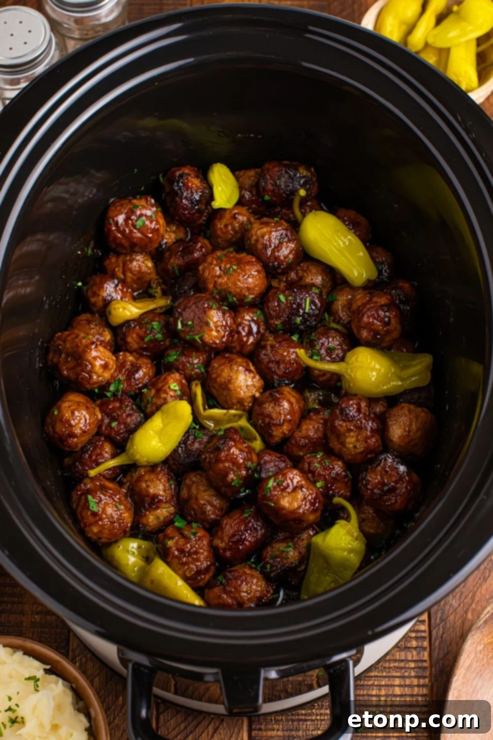 5 Ingredient Crockpot Mississippi Meatballs 16 overhead look at the table with a Crockpot with Mississippi Meatballs in it