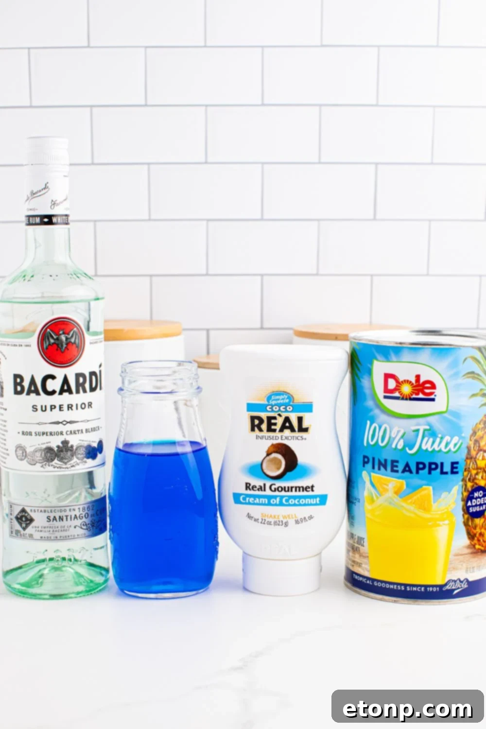 ingredients for Frozen Blue Hawaiian Cocktail on table
