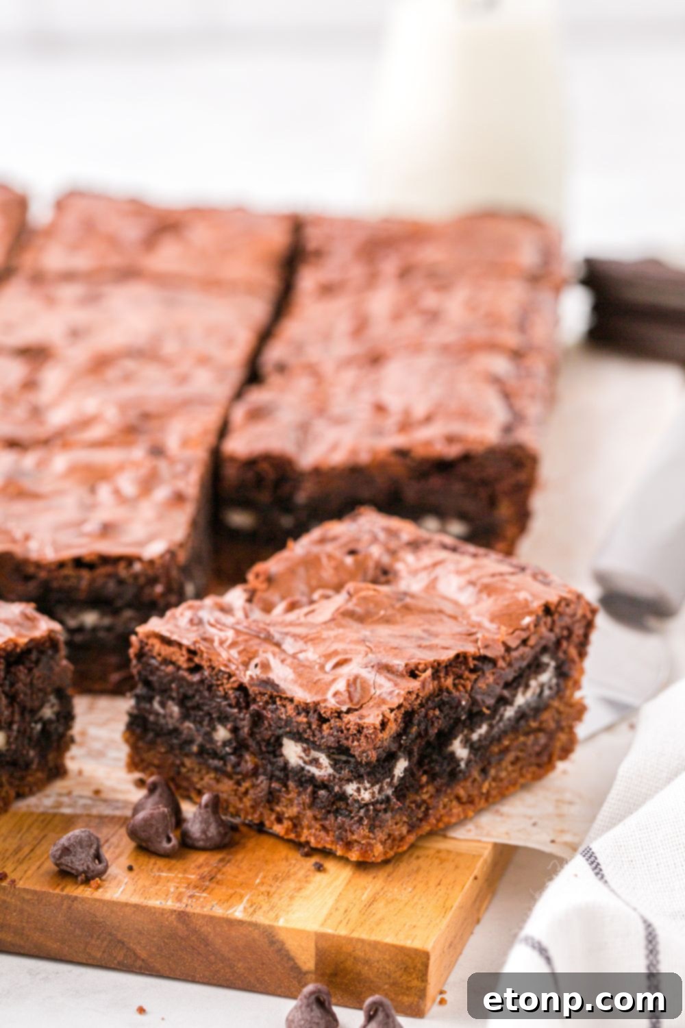 Slutty Brownies sliced in squares with Oreo cookies in the center 