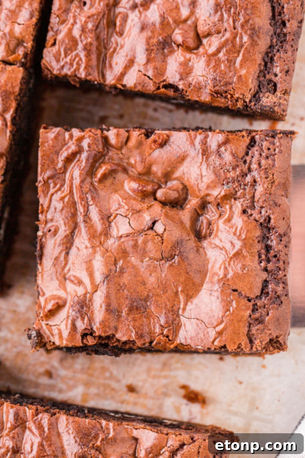 Slutty Brownies sliced in squares and placed on cutting board 