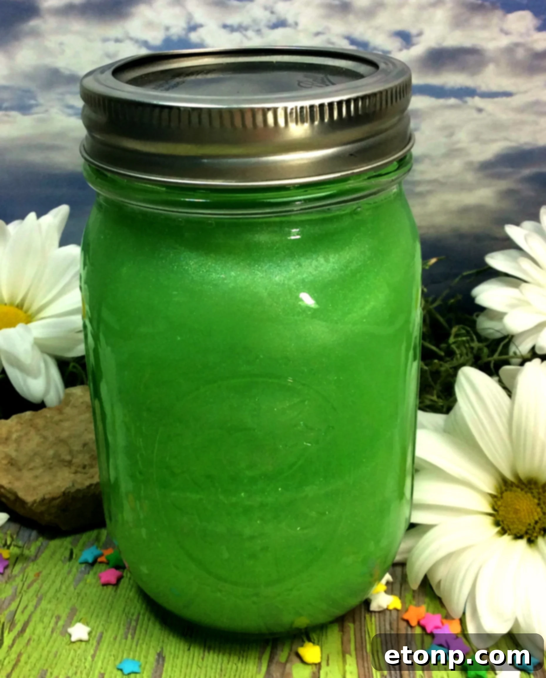 Mason jars filled with Fairy Moonshine and garnishes
