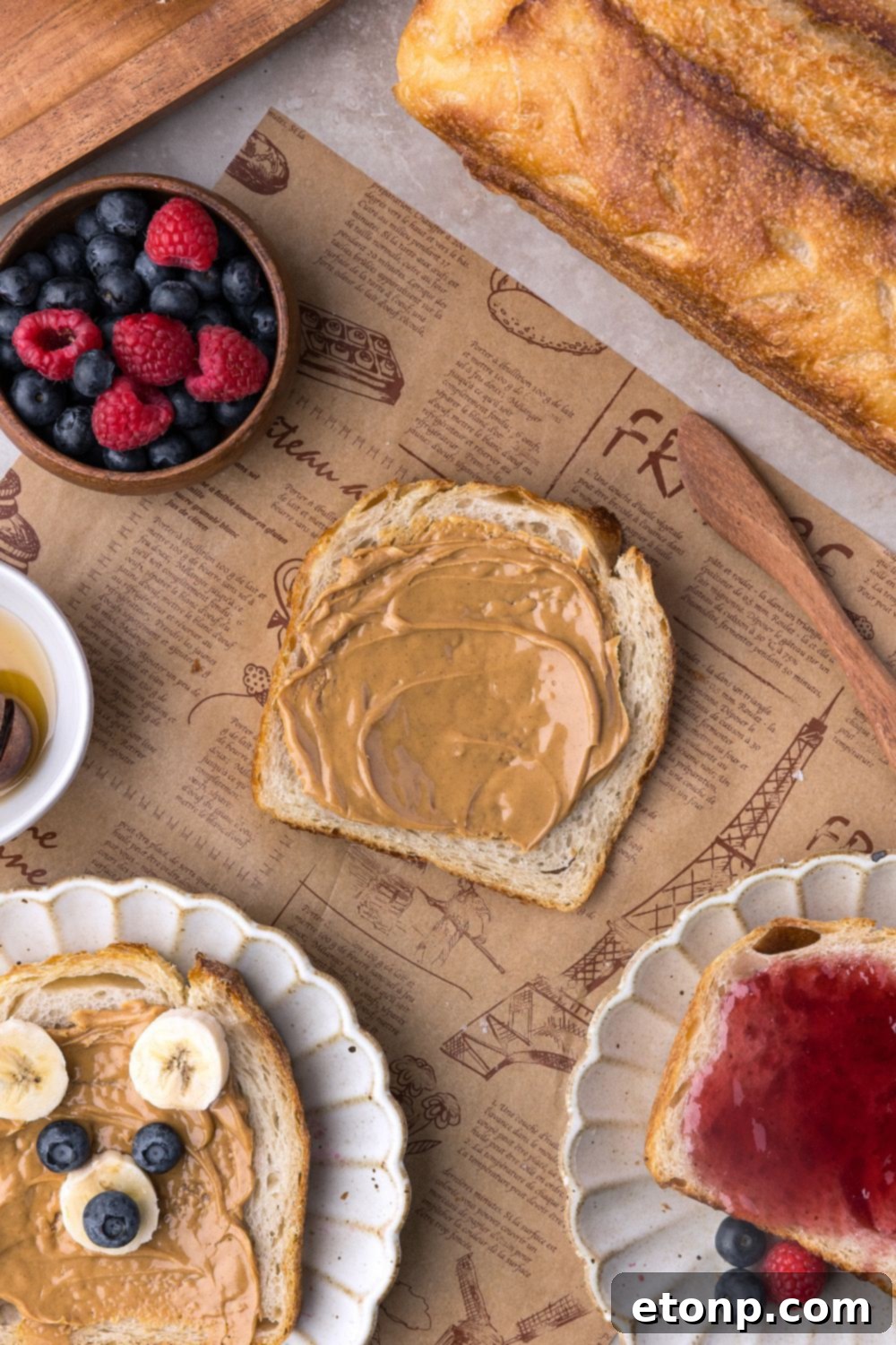 bread decorated with peanut butter and fruit to look like a bear, more bread with jam, and more Homemade Sourdough Bread with peanut butter 