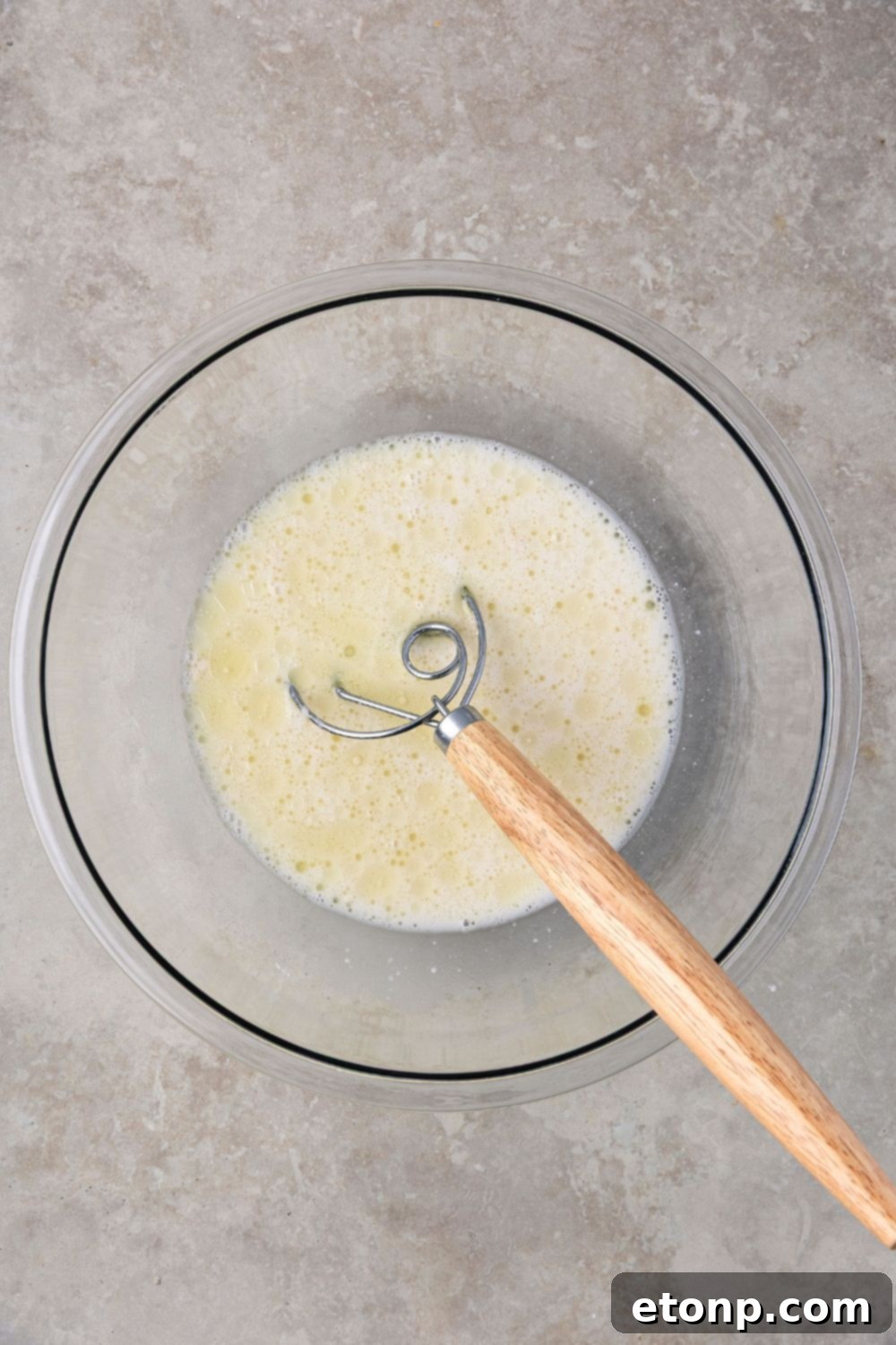 wet ingredients in a bowl for making Homemade Sourdough Bread