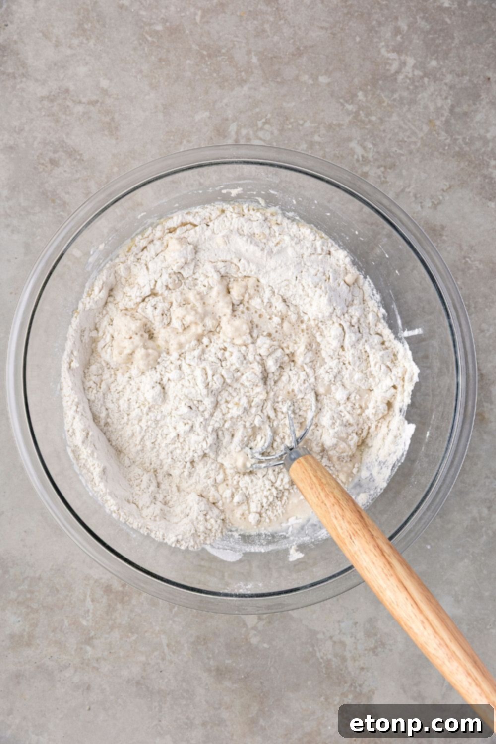 dry ingredients for making Homemade Sourdough Bread in glass bowl on table 