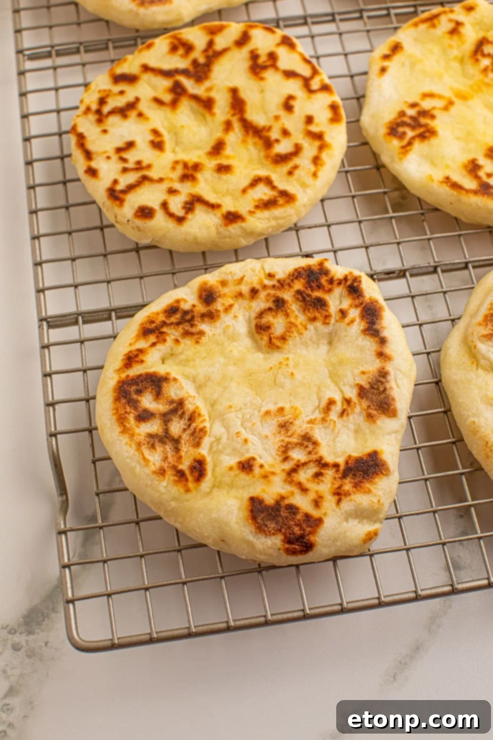 3 Ingredient Flatbreads on a cooling rack in a single layer 
