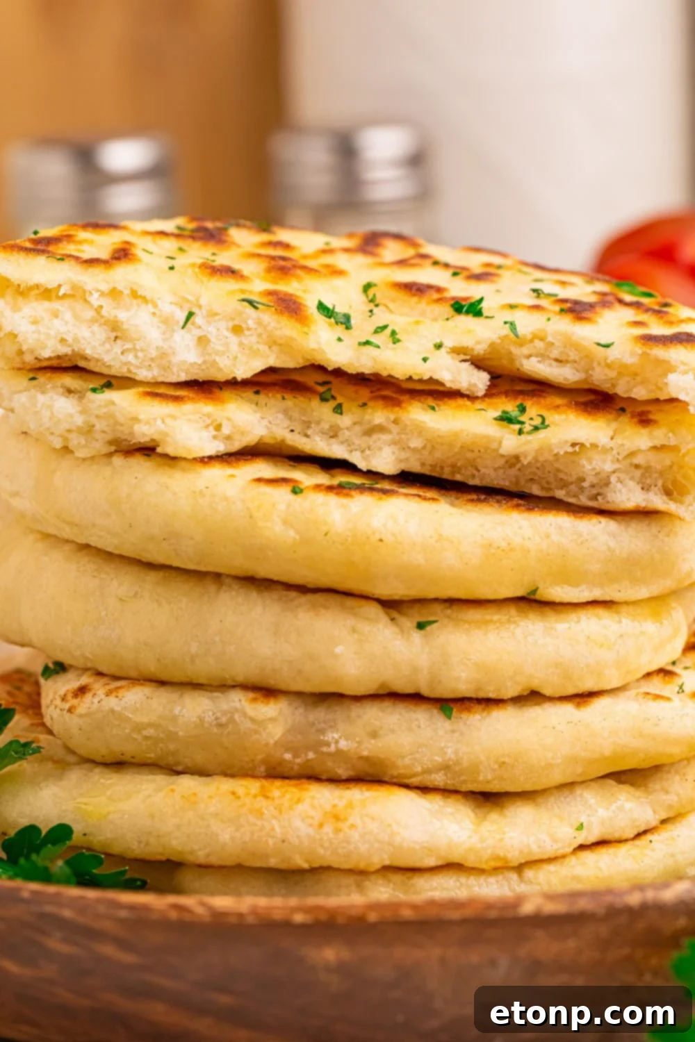 3 Ingredient Flatbread stacked on tray but some sliced in half 