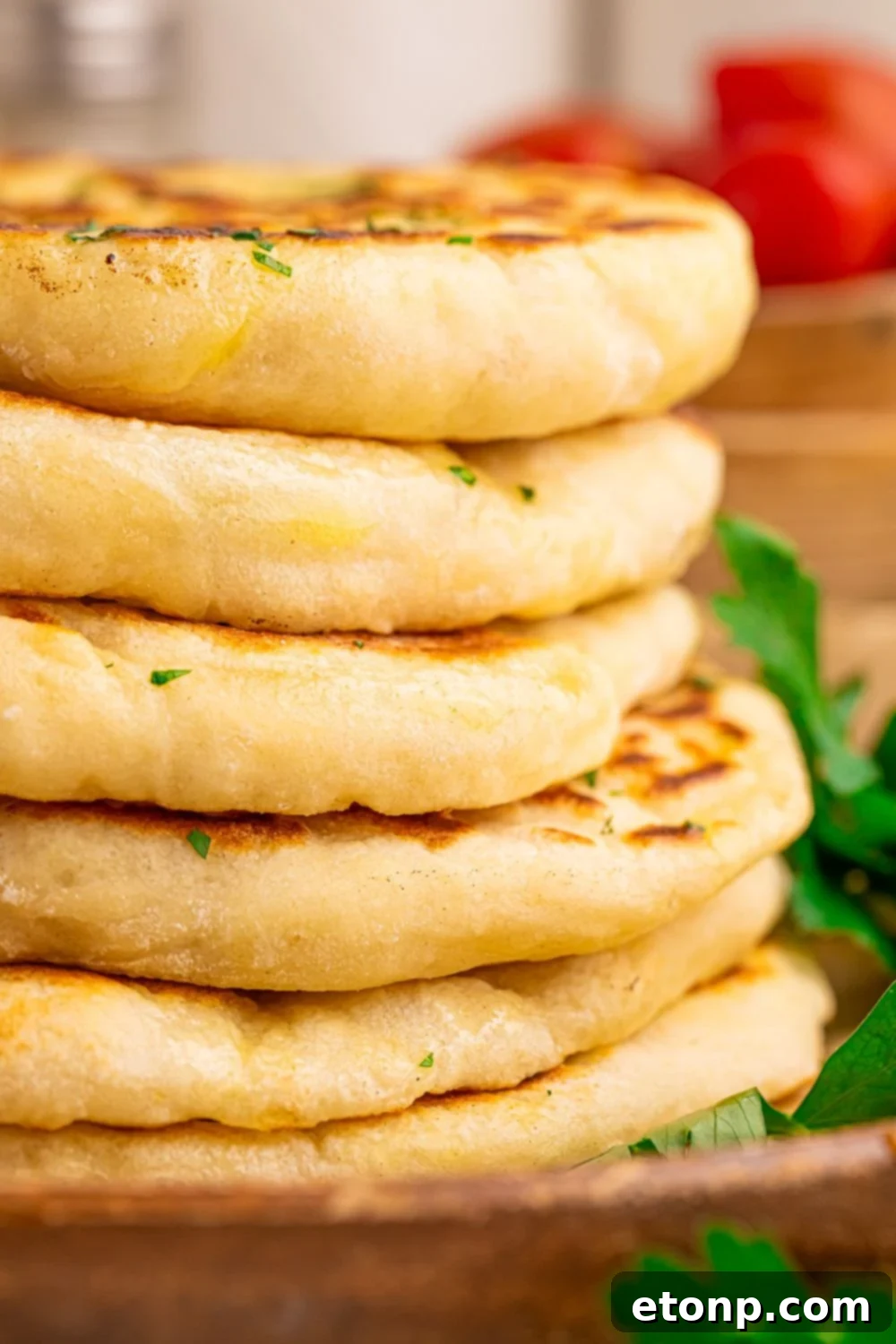 3 Ingredient Flatbread stacked on top of each other, to show how thick and fluffy they are 