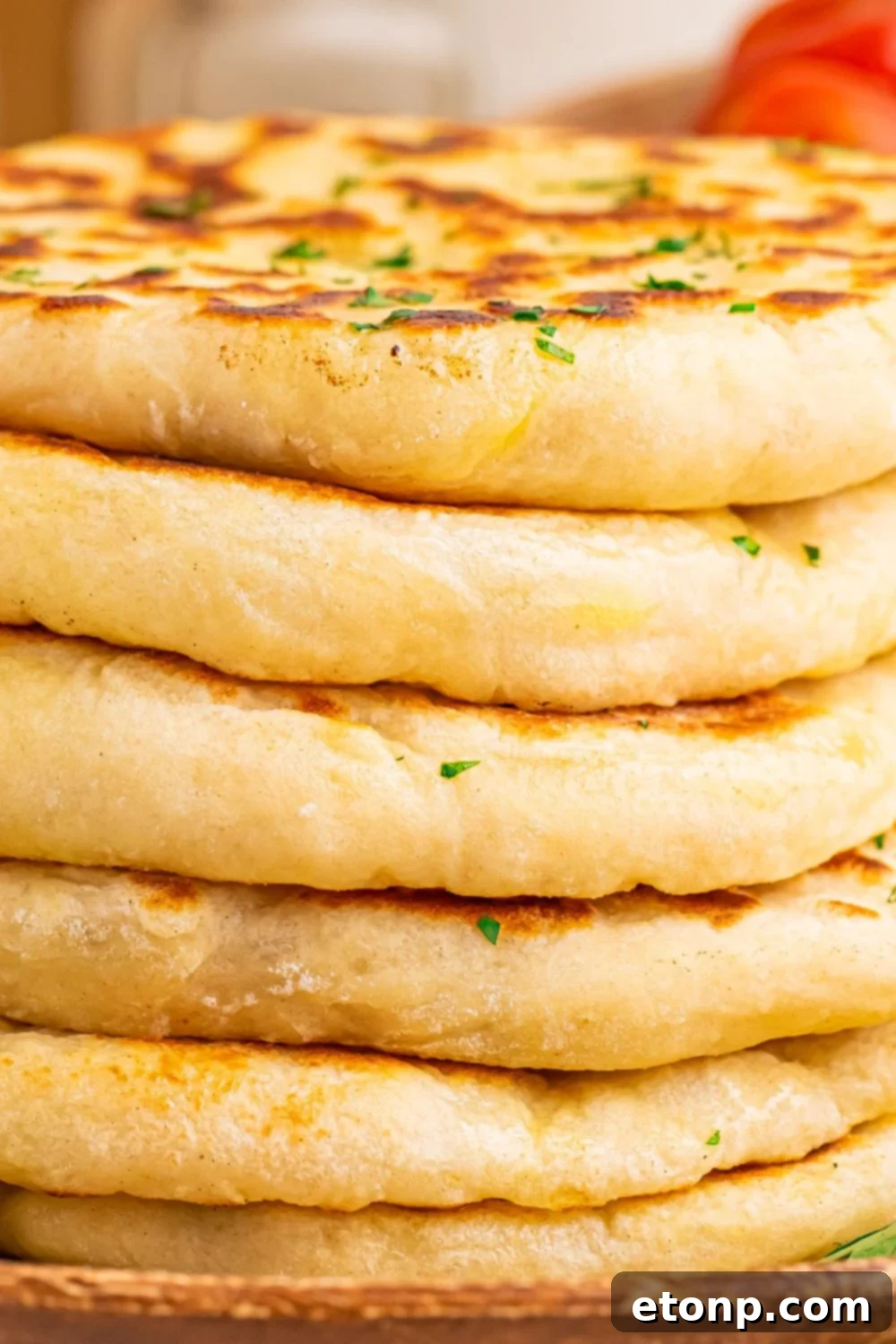 close up of a stack of 3 Ingredient Flatbread to show how thick and fluffy they are 