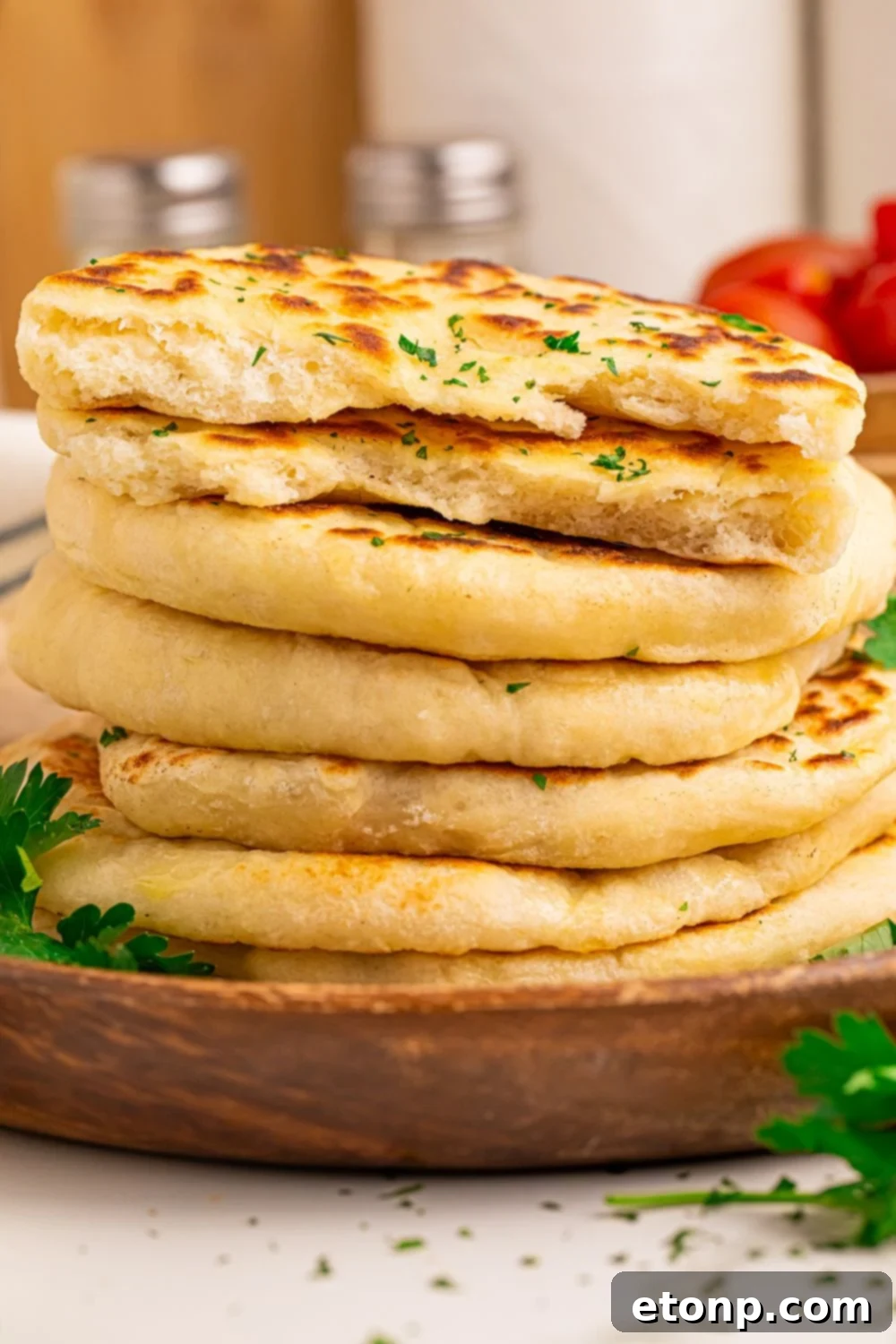 3 Ingredient Flatbread stacked on top of one another in a tower with parsley on top 