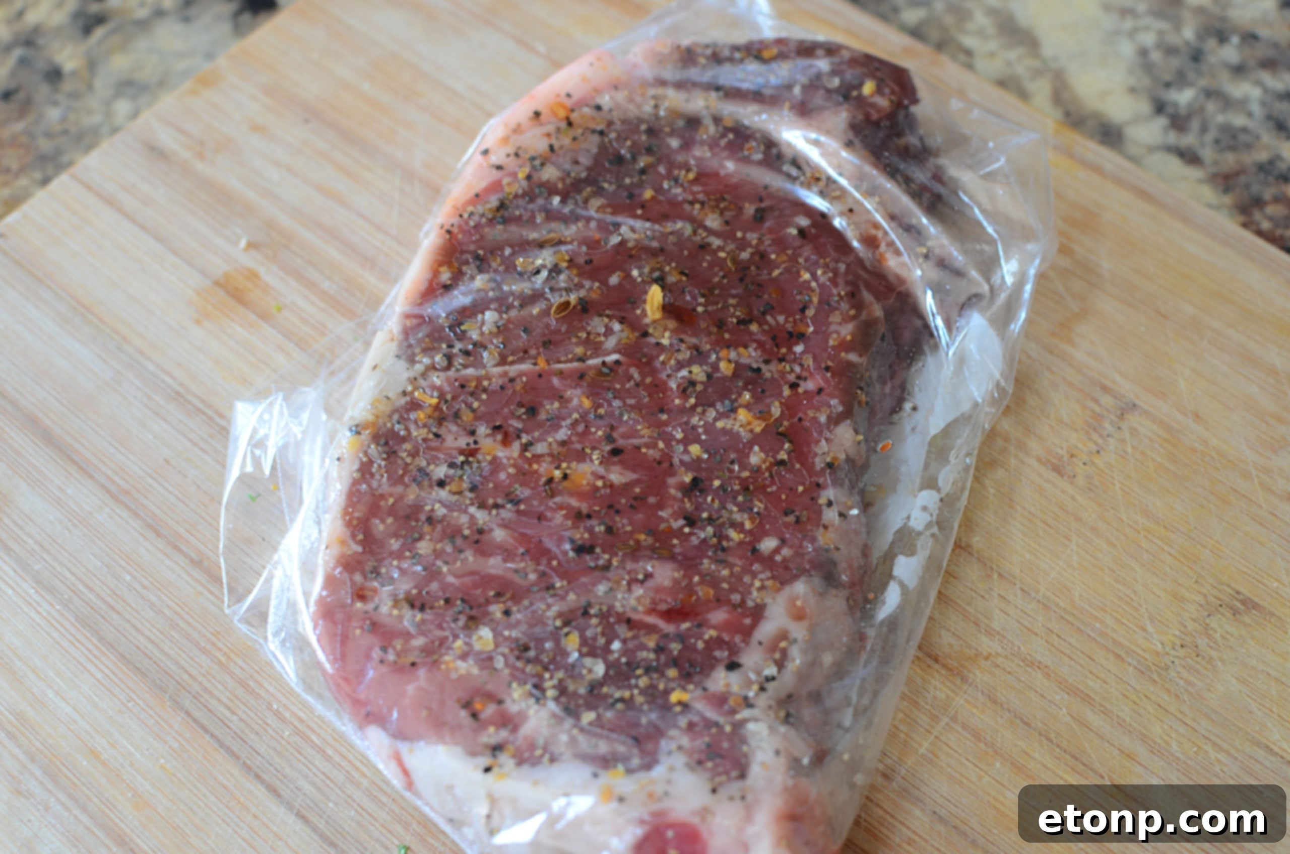 Sliced steak revealing a perfect medium-rare doneness and moist texture, ready for serving.