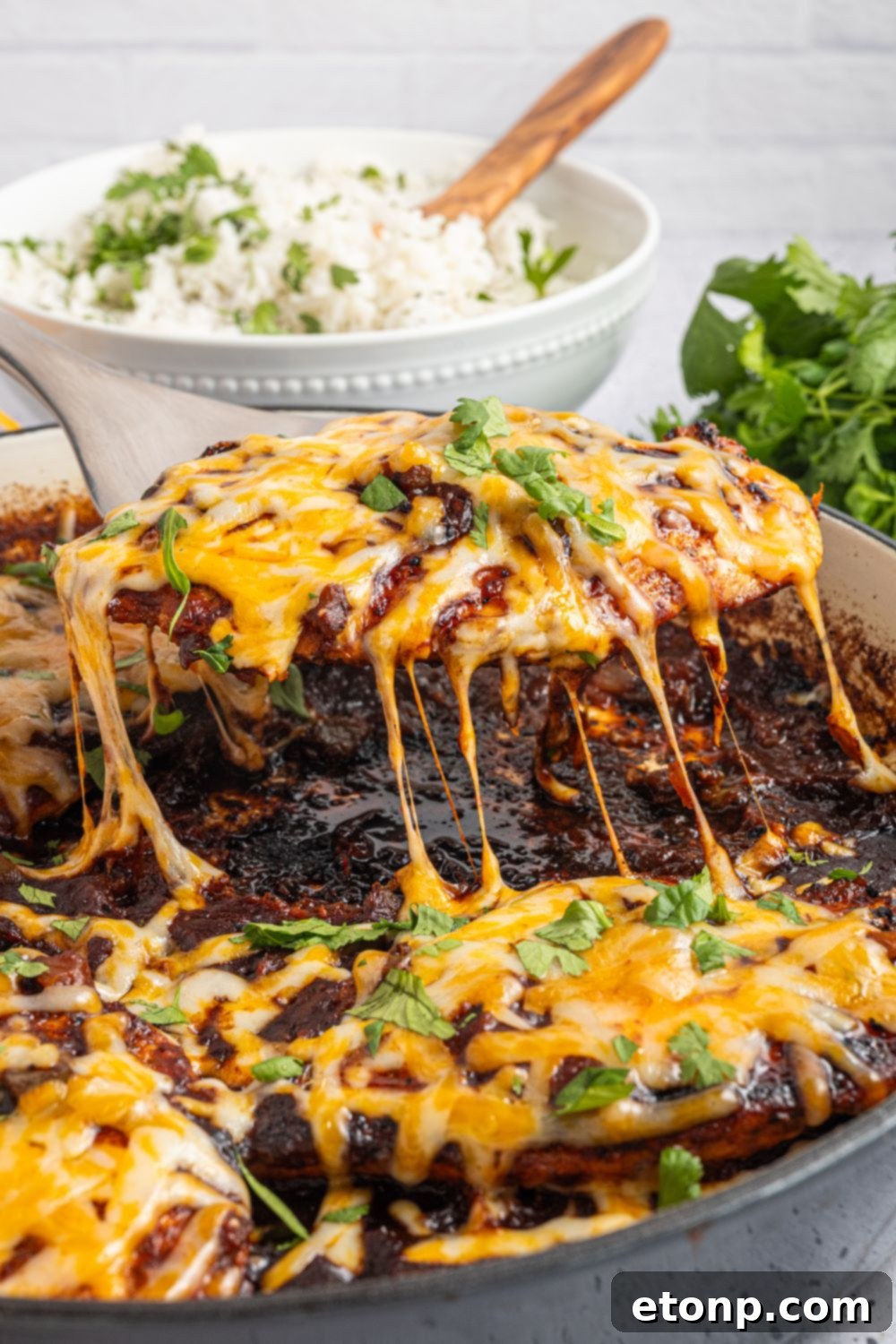 One Pan Cheesy Salsa Chicken 13 Cheesy Salsa Chicken being lifted out of pan