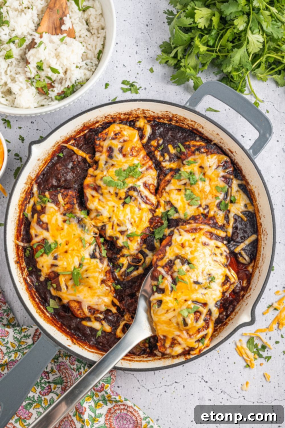 One Pan Cheesy Salsa Chicken 20 Cheesy Salsa Chicken on pan with a spatula being lifted out of pan