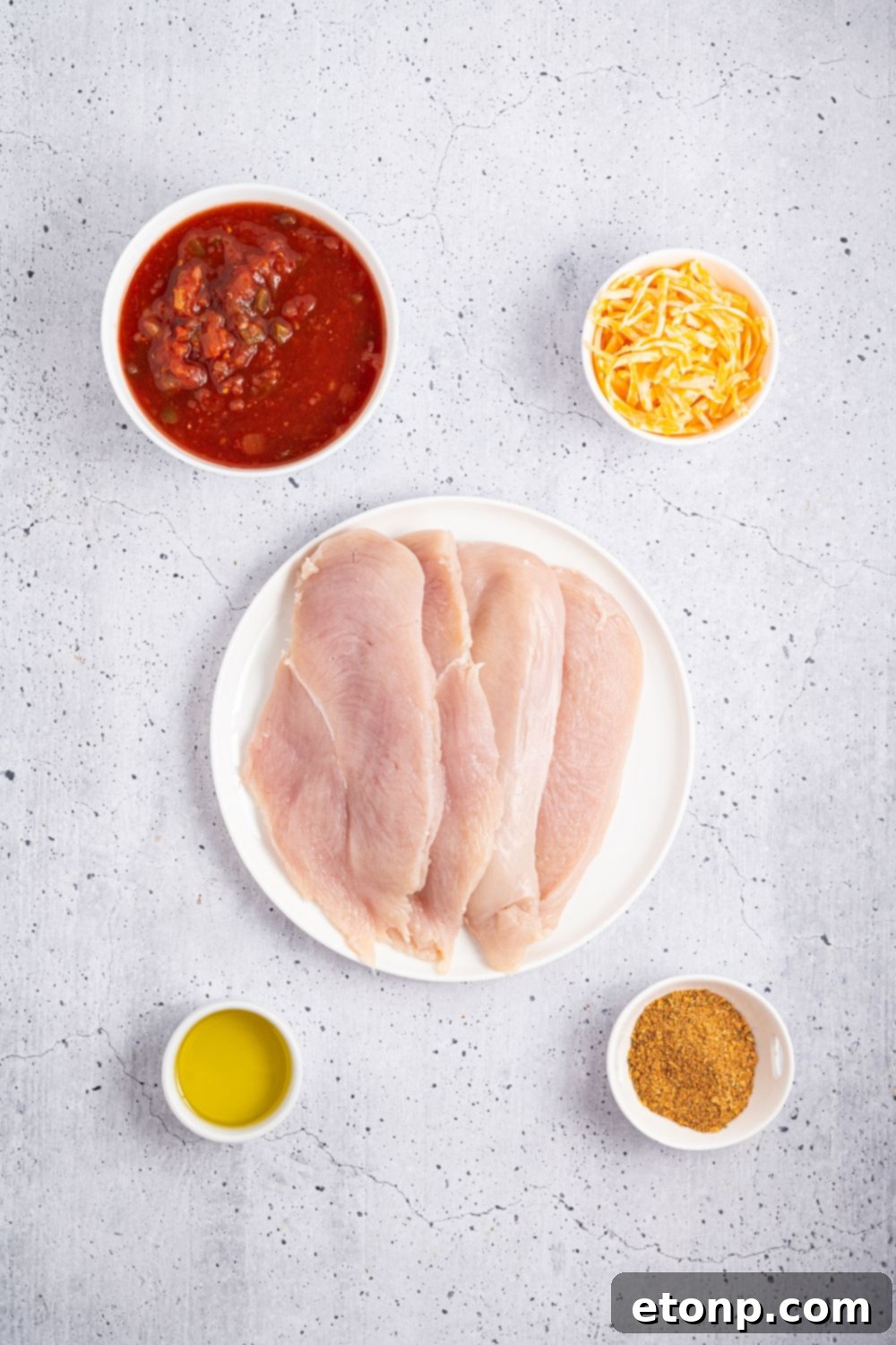 One Pan Cheesy Salsa Chicken 6 Cheesy Salsa Chicken ingredients on table in single serve bowls