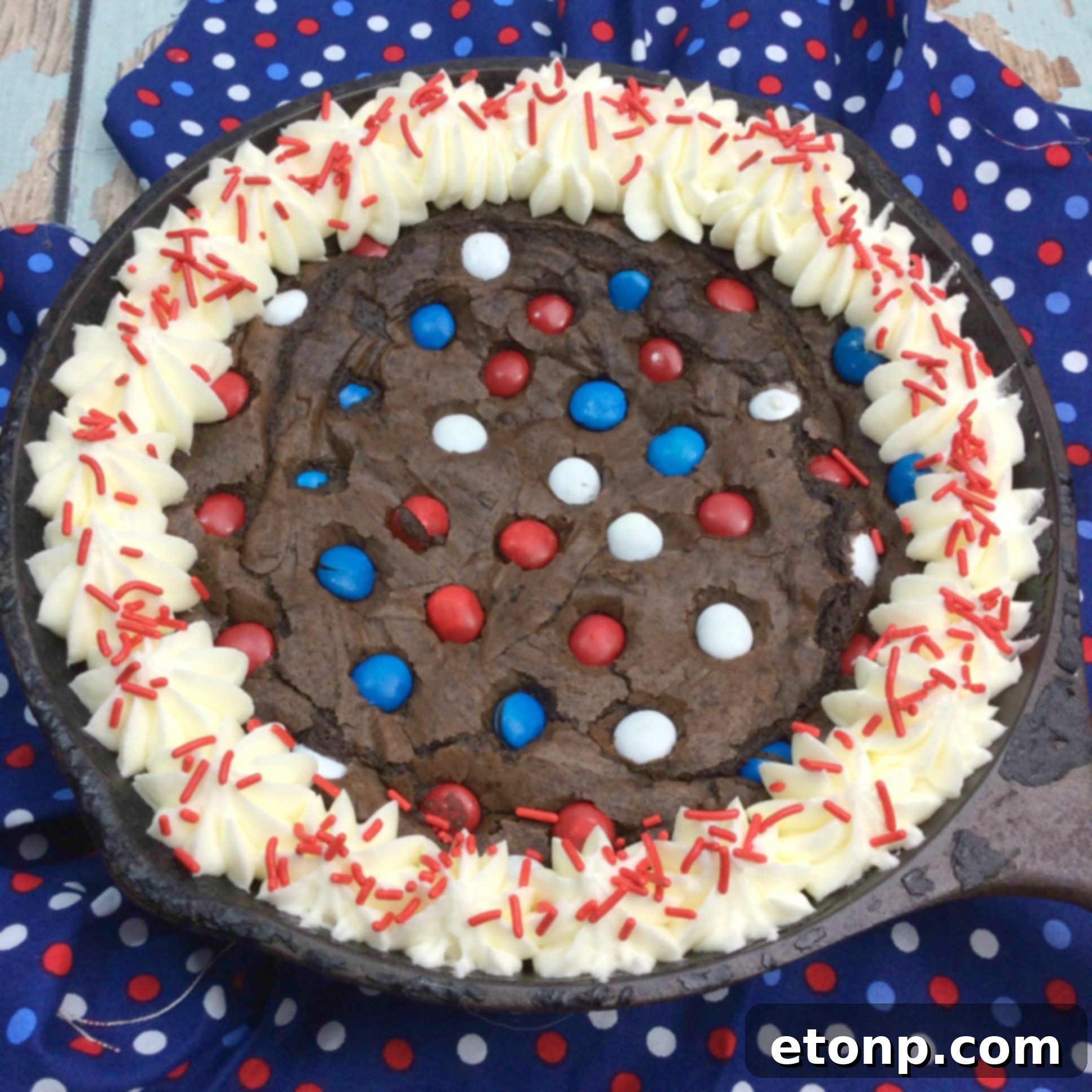Rustic Cast Iron Fudge Brownie 4 Scoop of vanilla ice cream melting on a warm Cast Iron Fudge Brownie Skillet