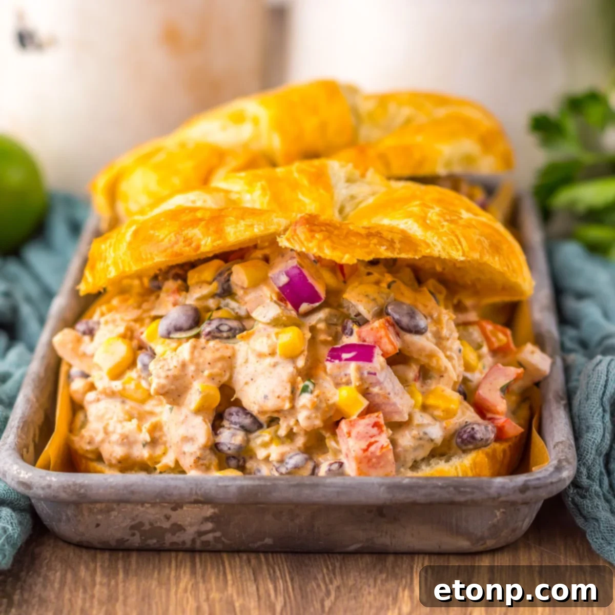 Creamy Taco Chicken Salad served in mini croissants on a white plate