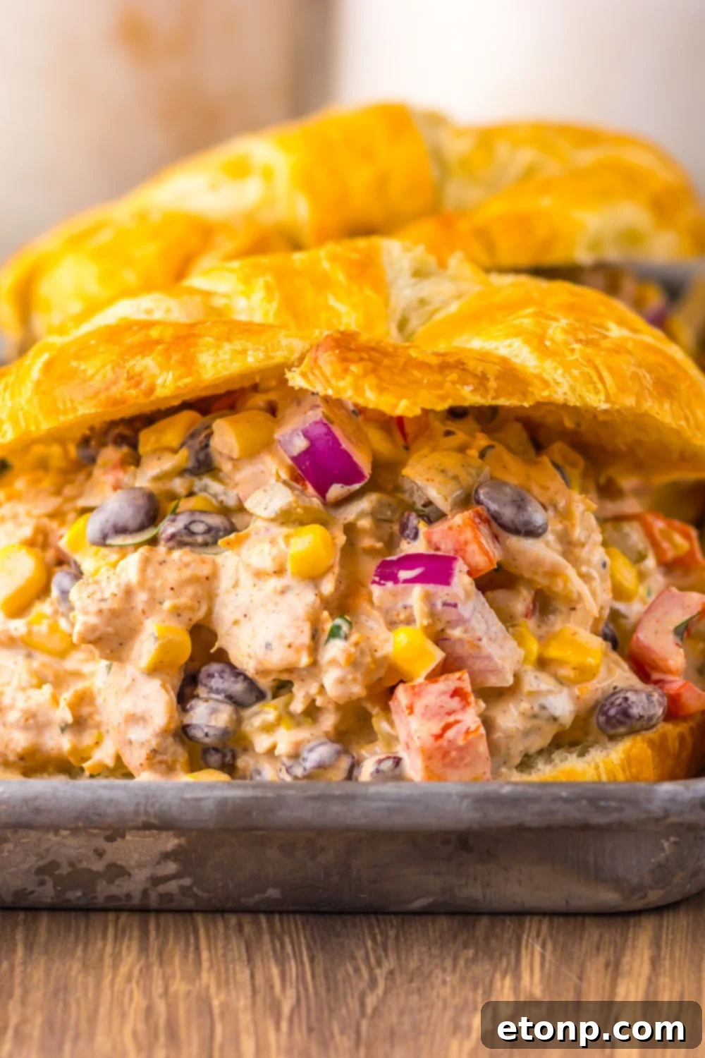 Close-up view of Creamy Taco Chicken Salad sandwiches, showing the delicious filling.
