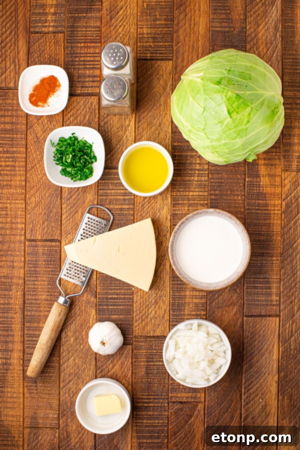 ingredients for Creamy Garlic Parmesan Cabbage on table in single serve containers to show all the ingredients in recipe 