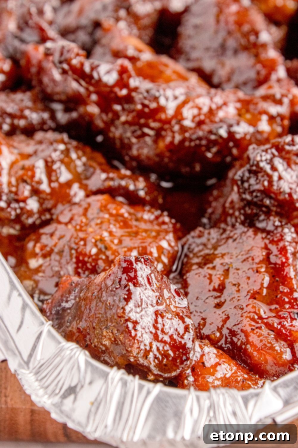 close up of Chuck Roast Burnt Ends in a pan sitting on table
