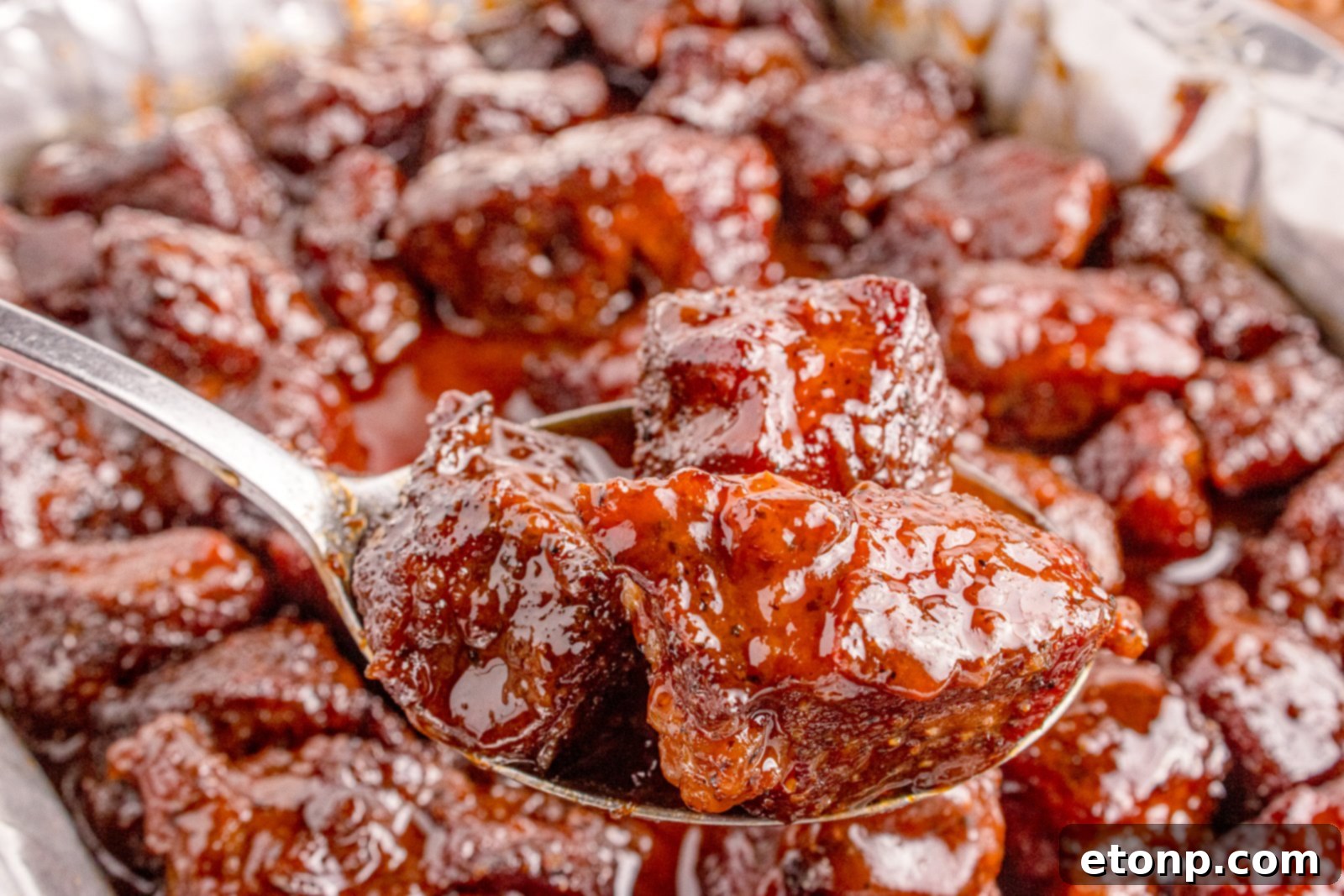 Up close shot of the Chuck Roast Burnt Ends on a spoon