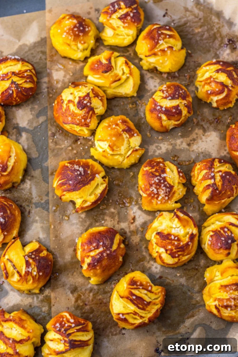Easy Biscuit Pretzel Bites spread out on a baking sheet