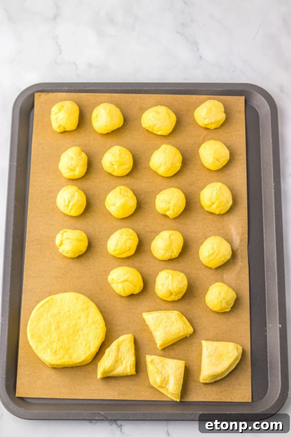 biscuit dough cut into pieces and rolled into balls