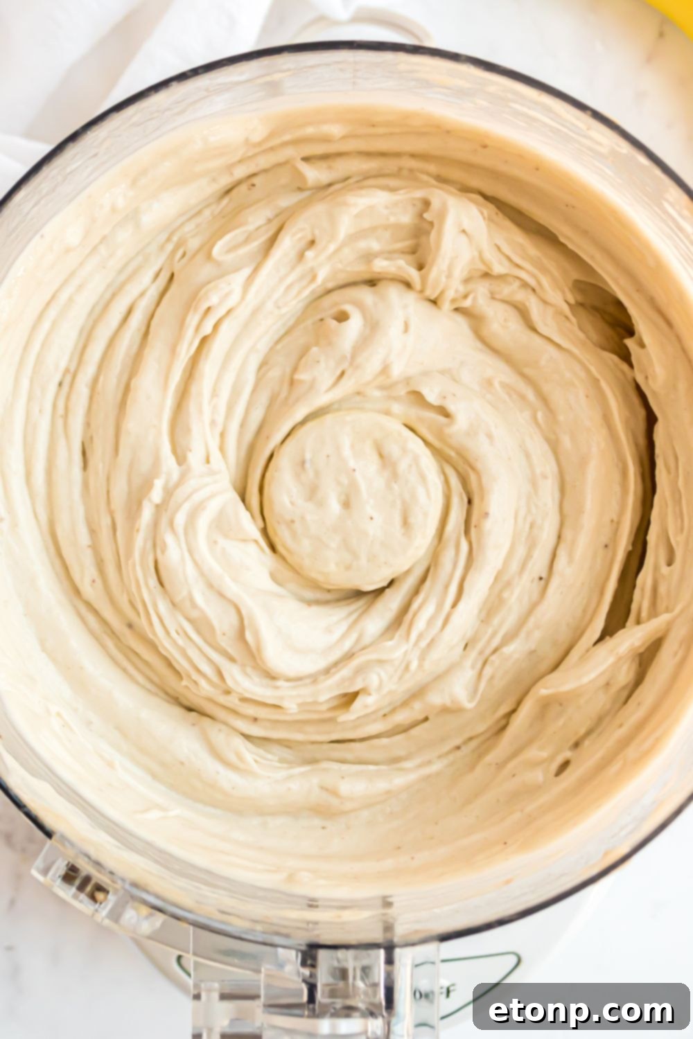 Effortless One-Ingredient Banana Ice Cream 19 overhead look of food processor full of Banana Ice Cream