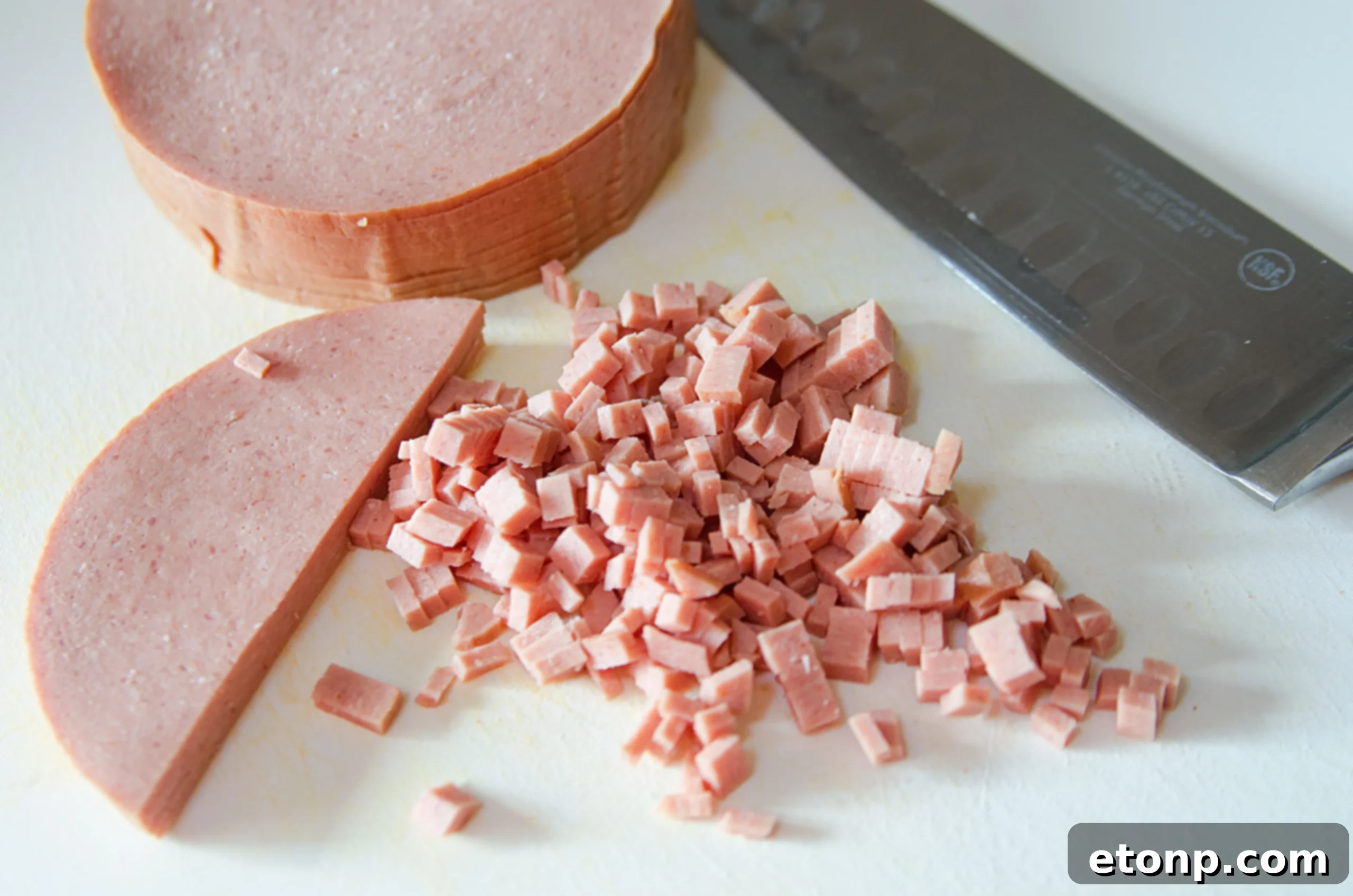 Close-up of Fried Bologna Tornado Salad, showing creamy texture and crispy bologna