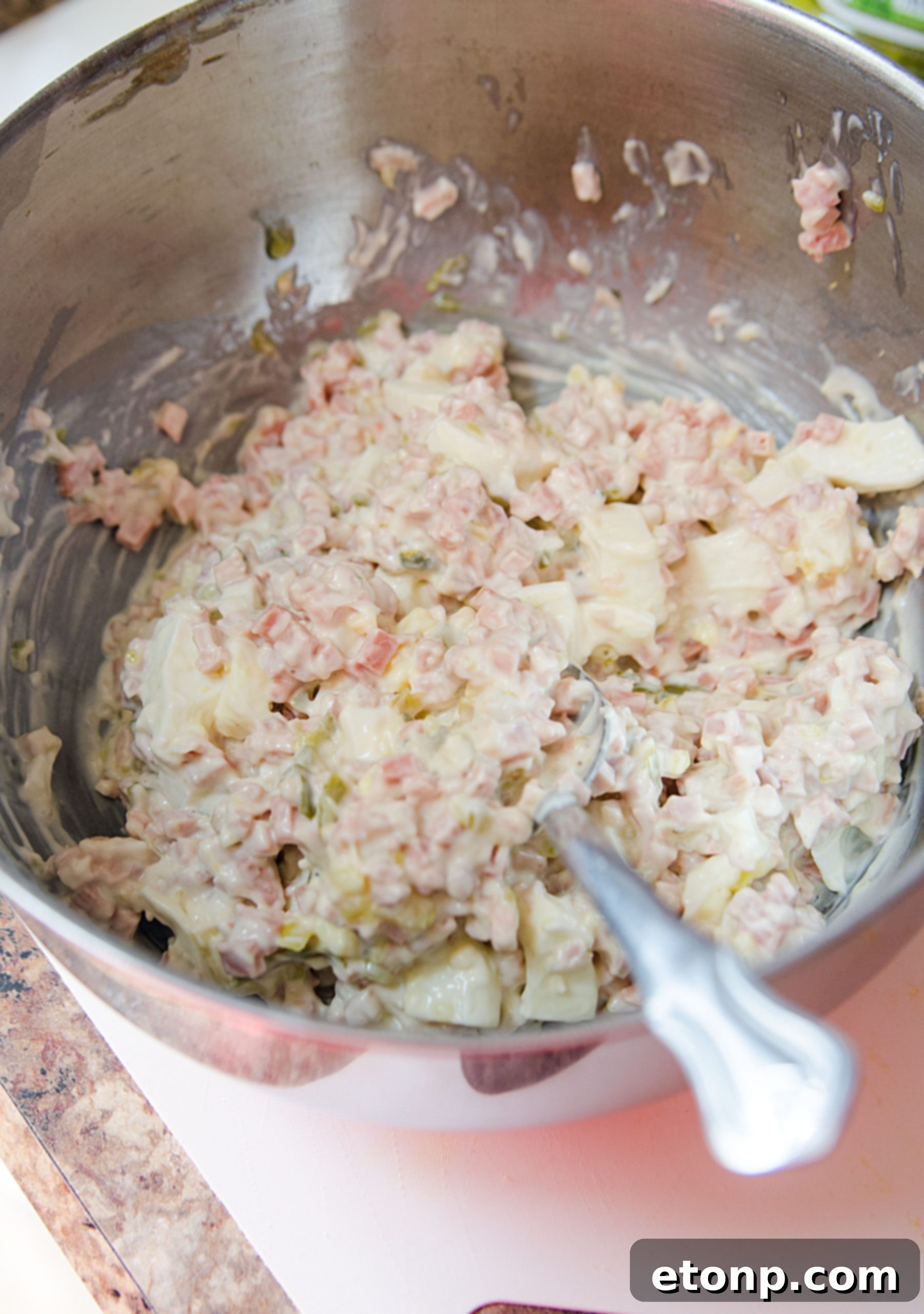 Ingredients for Fried Bologna Tornado Salad laid out on a table