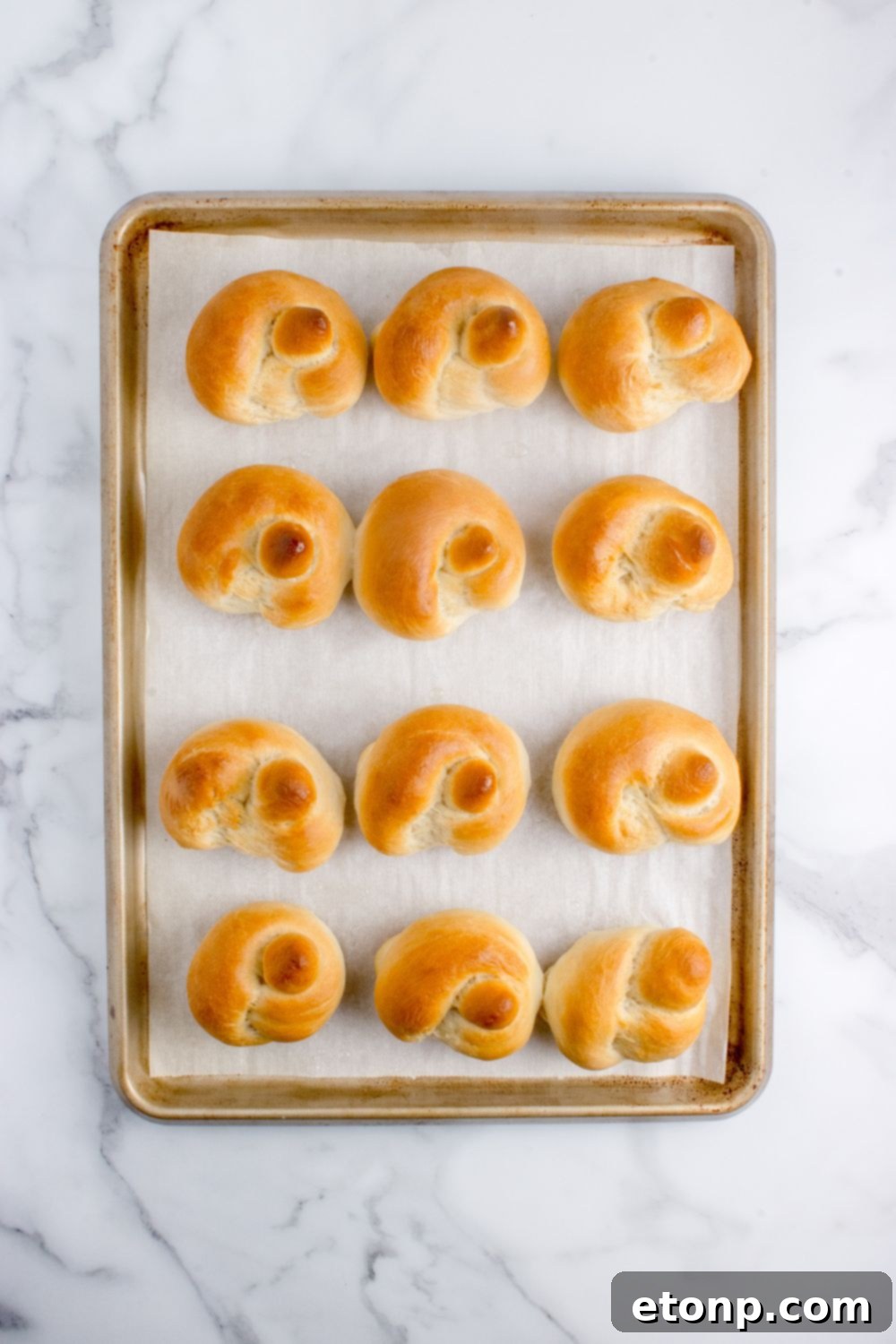 baked garlic knots on a tray on table